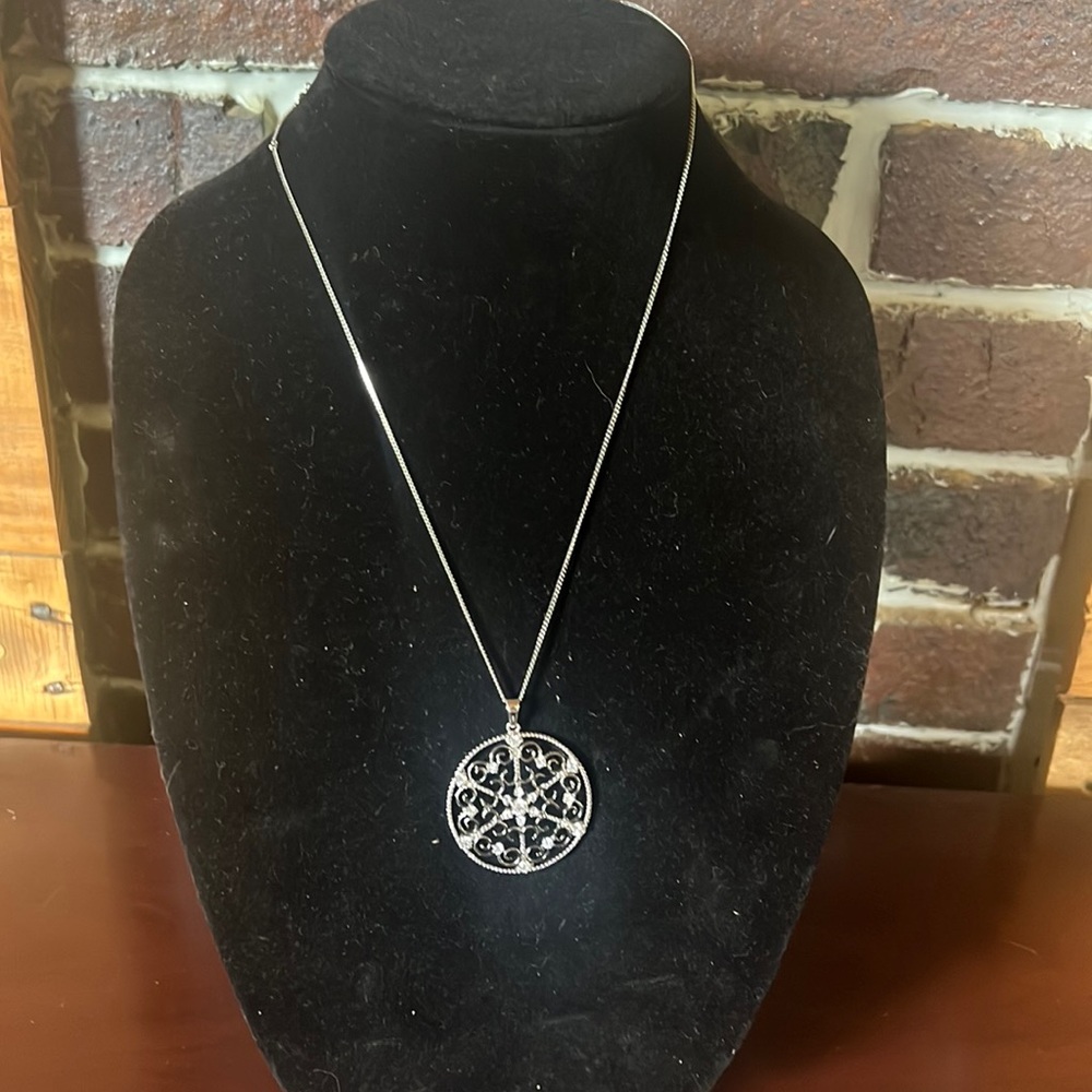 Silver necklace with a beautiful intricate metal